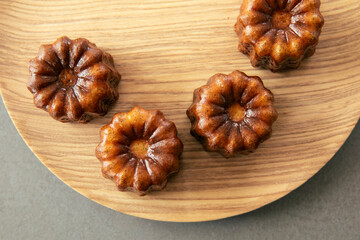 Four Golden French Canelé Fresh From The Oven