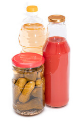 Food Reserves: Canned Food, Sunflower Oil and Tomato Juice - Isolated on White Background. Emergency Food Storage in Case of Crisis. Strategic Food Supplies - Isolation