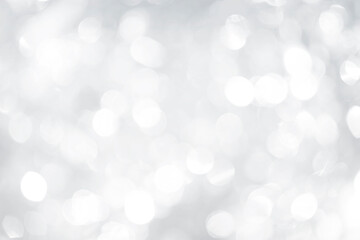 Abstract blurred glowing silver bokeh background, festive season concept background