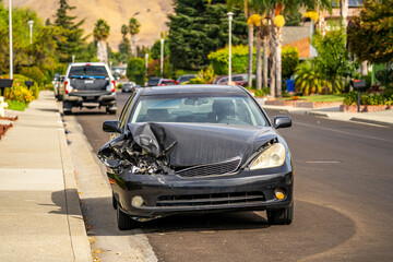 Car accident on the road. Smashed front of passenger car.