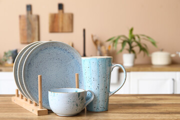 Beautiful clean dishes on table in kitchen, closeup