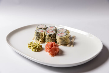 Sushi with shrimps on white plate