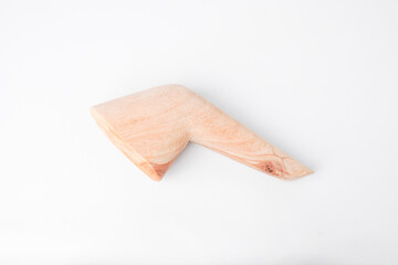 Close-up photo of Javanese wooden pestle isolated on white background.