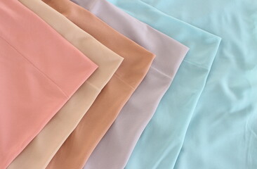 Variety of Soft Pastel Colored Fabric Textures Flat Lay