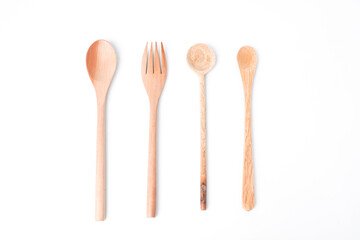 Close-up photo of wooden table spoon, fork and teaspoon isolated on white background. High angle, Flat Lay, Bundling Setup Cutlery.