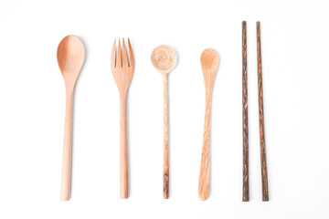 Close-up photo of wooden table spoon, fork, teaspoon and chopsticks isolated on white background. High angle, Flat Lay, Bundling Setup Cutlery.