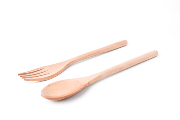 Close-up photo of wooden table spoon and fork isolated on white background. Shot on 30 Degree angle, Bundling setup.