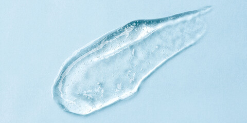 Transparent Skin care Product Smear on Blue Background