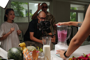 Team of operators shooting process of cooking cocktail