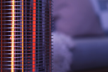 Modern electric heater in room at evening, closeup