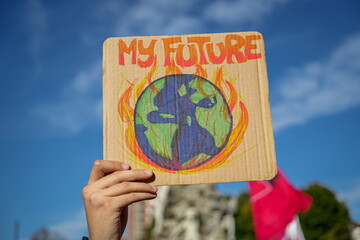 Hands and placards raised to the sky during the Global Climate Strike. 