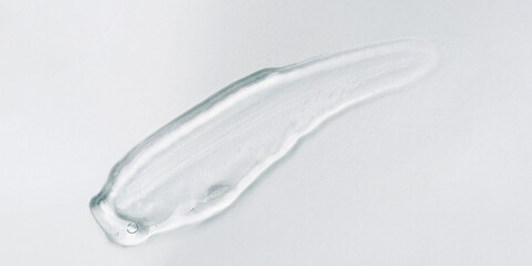 Transparent gel texture on a gray background.
