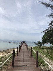 Crystal-clear water, sandy beach, gentle waves