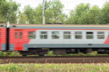 Side view of the moving train. Electric high speed passenger commuter train. Intercity express