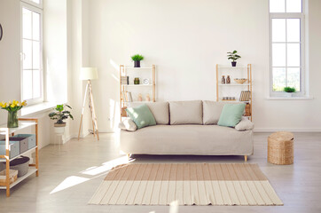 Modern interior fashion furniture inside modern empty light living room with white soft sofa, carpet, design interior ideas, new real-estate, rent property contemporary style, luxury accommodation