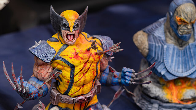 Budokan Geek Convention In GUAYAQUIL, ECUADOR - 
OCT 13, 2024 - Close-up of a detailed Wolverine figure in battle, with arrows and blood effects, showcasing the iconic X-Men character