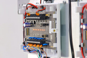 Security and fire alarm system. Connection by mounting wires. Close-up. Soft focus. 