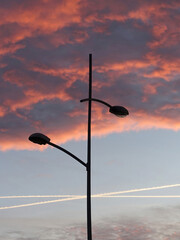 Street lamps on lamp post with colorful morning sky