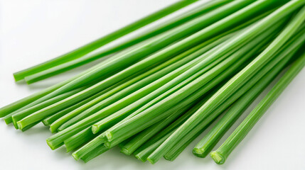 Obraz premium A close-up of fresh chives with their long, slender green stems, isolated on a white background