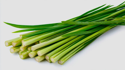 Fototapeta premium A close-up of fresh lemongrass stalks with their pale green color and fibrous texture, isolated on a white background