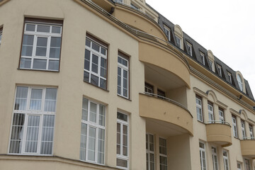 A very large and impressive building that features numerous windows and balconies throughout its structure and design