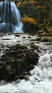 Vertical shot of cascading waterfalls in an autumn forest, Josefsthaler Wasserf&auml;lle