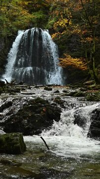 Vertical shot of cascading waterfalls in an autumn forest, Josefsthaler Wasserf&auml;lle