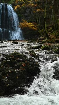 Vertical shot of cascading waterfalls in an autumn forest, Josefsthaler Wasserf&auml;lle