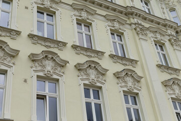 A large structure that features many windows adorning its exterior and providing light to the interiors within it