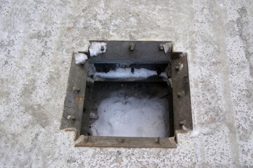 Technological opening in a monolithic concrete slab prepared for structural installation.