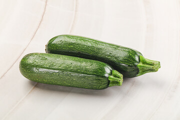 Raw green ripe zucchini vegetable