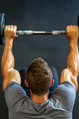 Fototapeta premium Man lifting dumbbells in gym workout