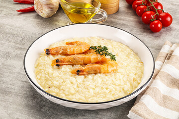 Italian risotto with prawn served thyme