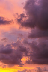 Stunning sunset with vivid pink and orange hues illuminating dramatic cloud formations.