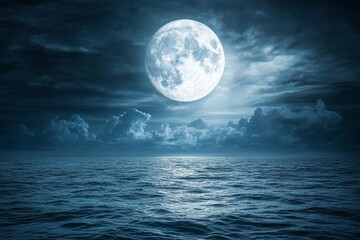 Over this calm ocean, a large full blue moon rises brightly