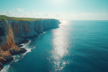 Aerial view of azure ocean waves breaking on the rocks. Kerala, India.