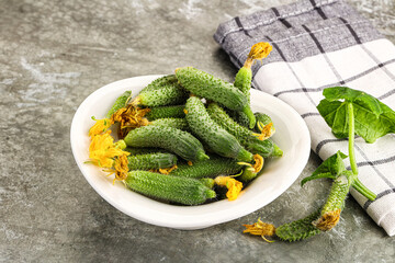 Raw gherkin cucumbers in the bowl