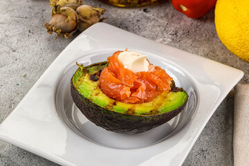 Whole grilled avocado with salmon