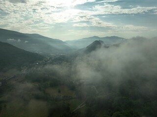 Misty mountain landscape with village