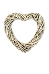 Heart shape wicker woven wreath on white background. Romantic symbol of love for Valentines Day, Mothers Day, Beltane, birthday or anniversary greeting card.