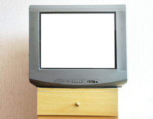 Antique TV with white screen on antique wooden cabinet, vintage design in 2000s and 90s style house.