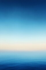 Fototapeta premium A serene, calm seascape with a tranquil blue sky, perfect for a minimalist background.