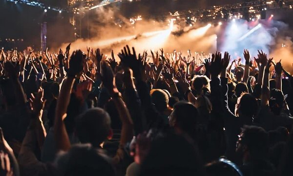 Many people were busy raising their hands. The crowd of fans waved. Epic live music concert atmosphere