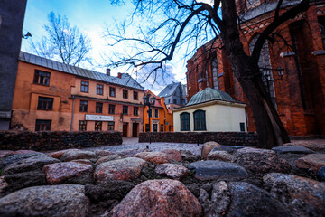 A quiet evening in Riga's Old Town showcasing cobblestone streets, rustic buildings, and historic architecture under a dusky sky