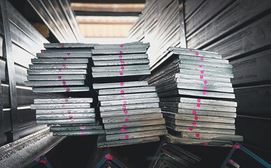 Flat Bar Steels stacking in the abstract pattern,Stack of Many Pipes at the Construction Site