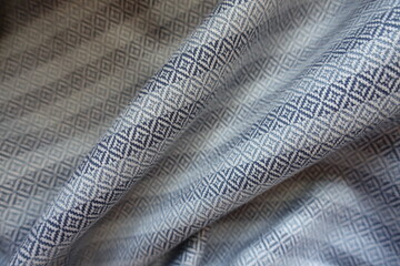 Folded ornamental cotton fabric in shades of grey