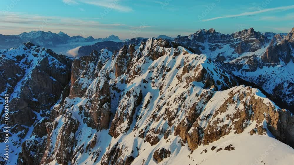 Wall mural aerial view of amazing rocky mountains in snow at sunrise, dolomites, italy, 4k