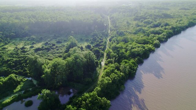 Aerial drone view over river of pathway in the jungle to Marienbosch, commewijne Suriname