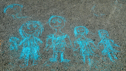 Family. Children's chalk drawing on the asphalt.