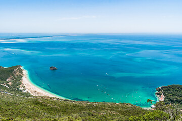 Panoramic and aerial view from the mountain to Portinho da Arrábida beach and Tróia on the horizon, Setúbal PORTUGAL